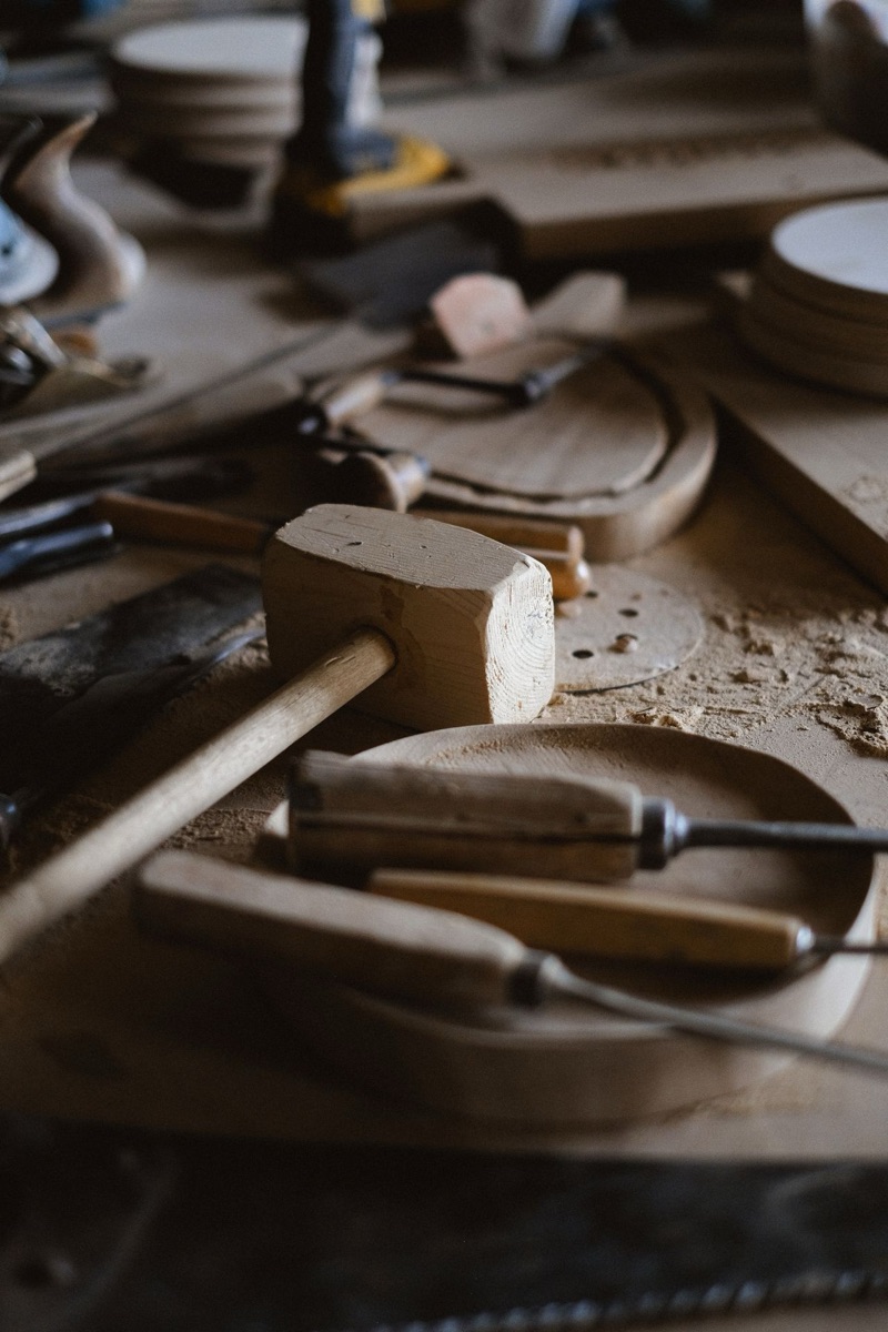 An assortment of carpentry hand tools on a workbench