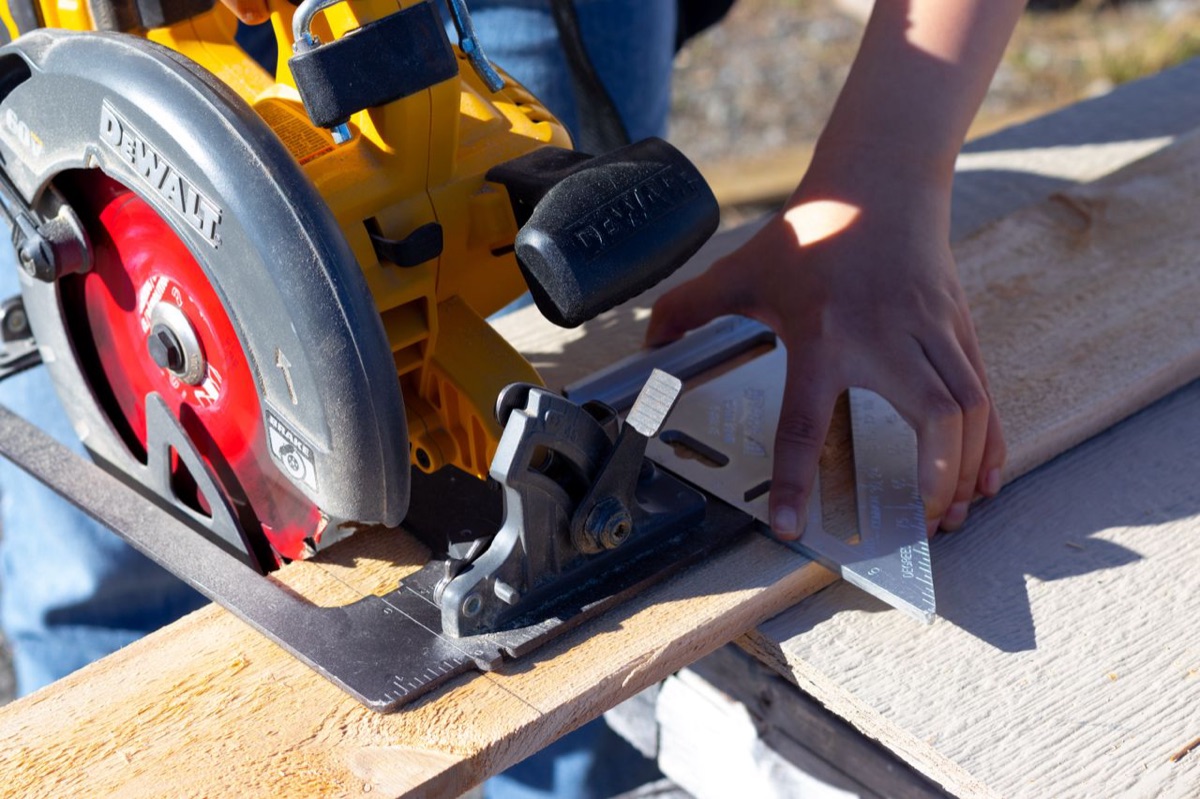 Cutting a board with a circular saw and a speed square