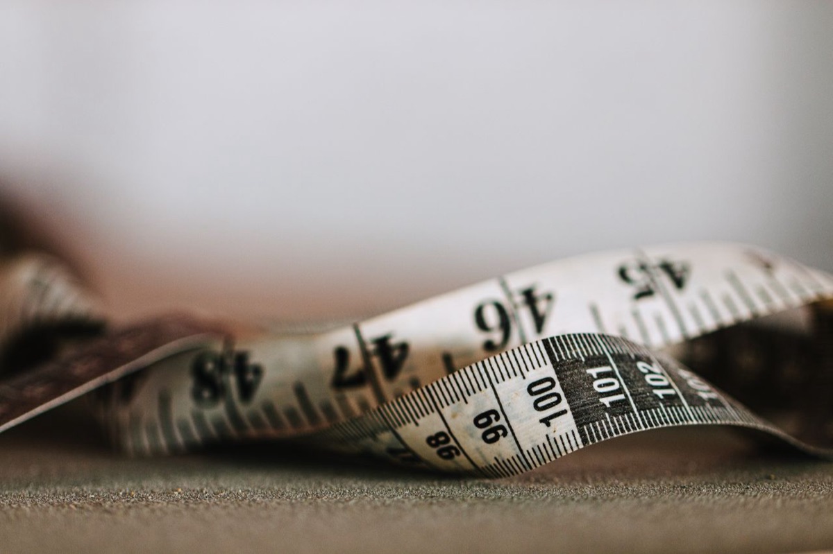 Close-up of the fine graduation marks on a measuring tape
