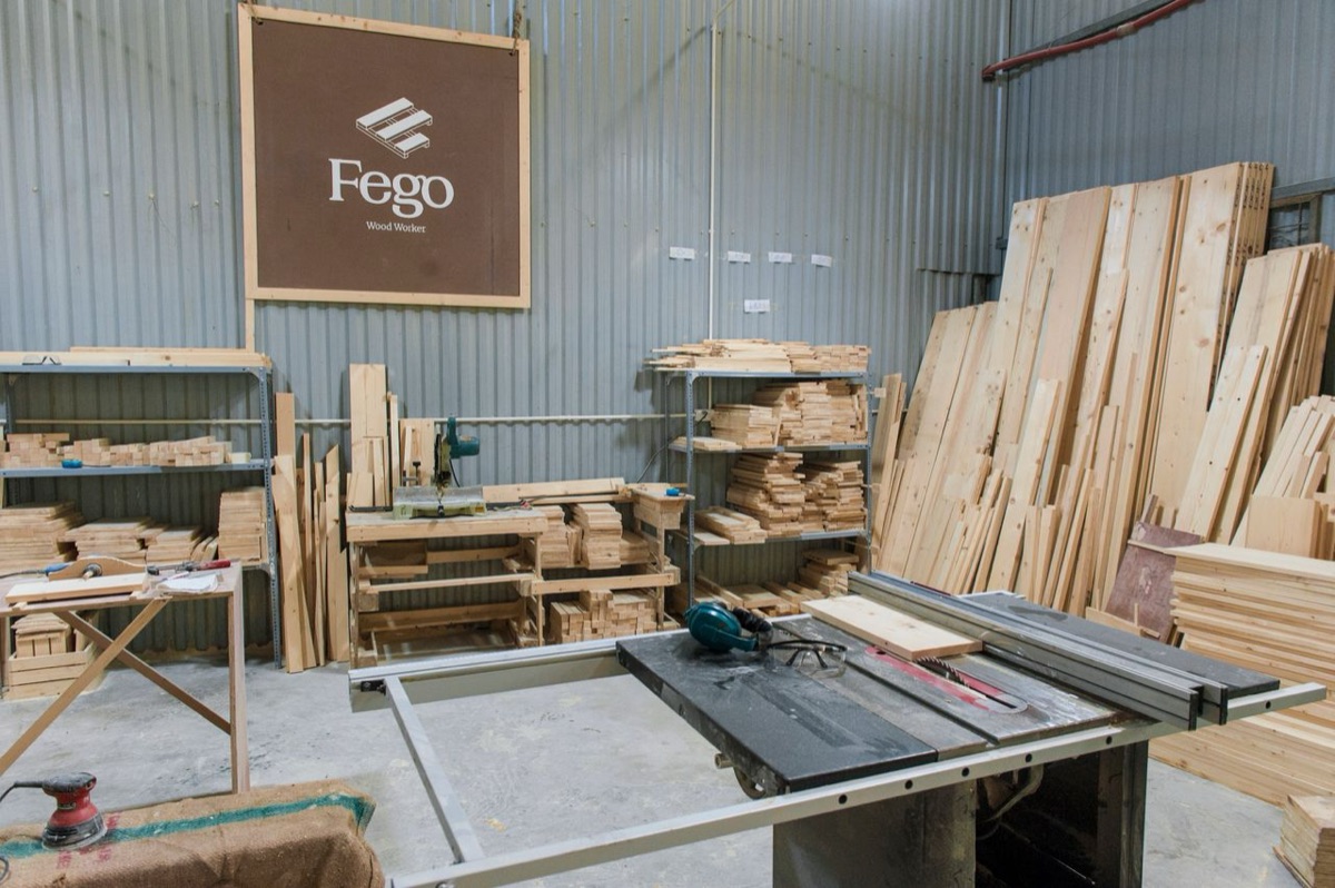Stacks of cut lumber in a woodworking workshop