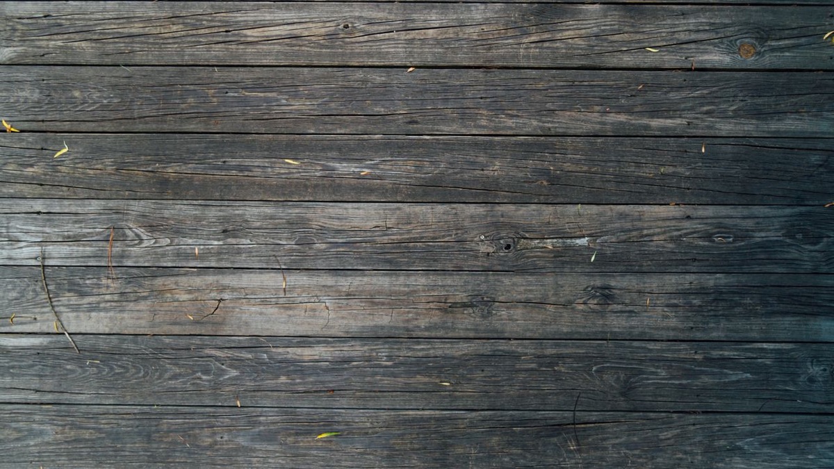 Top-down view of weathered wooden deck boards